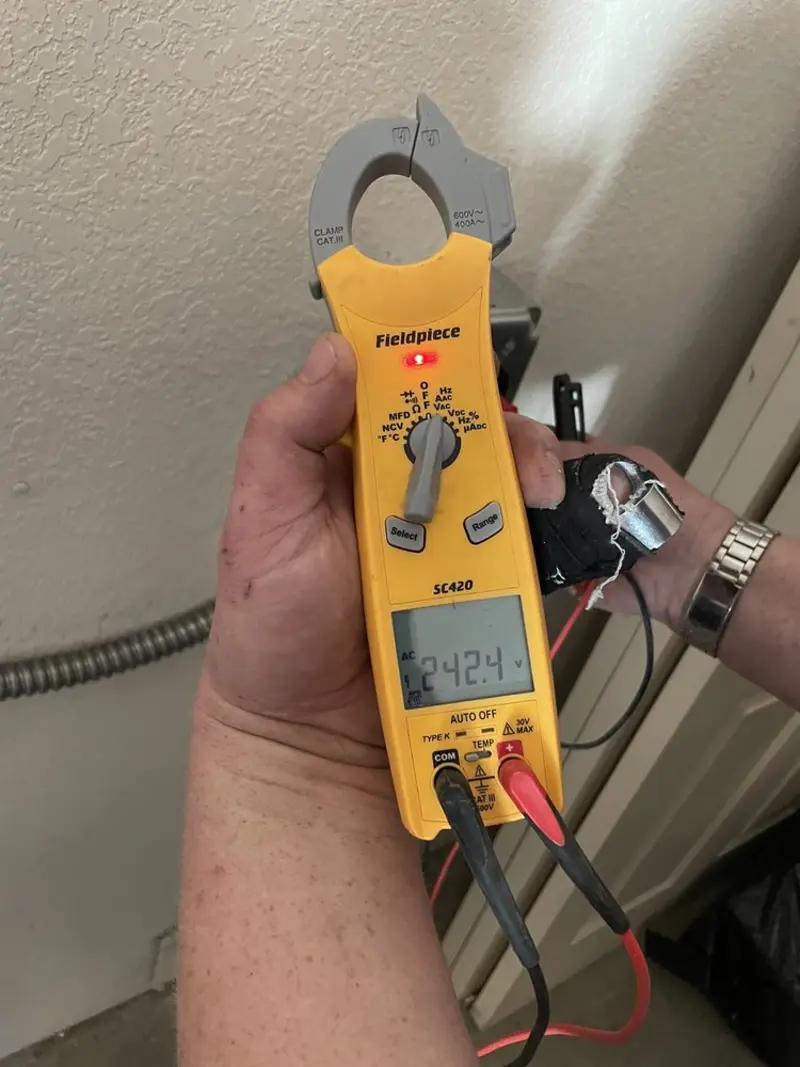 Voltage testing with clamp meter during Ceiling Fan Installation in The Meadows